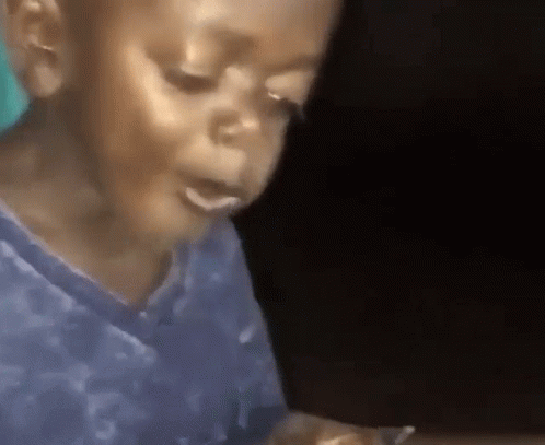 boy eating and smiling gif