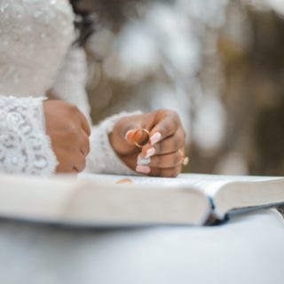 hands holding wedding ring