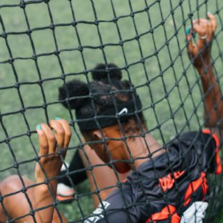 female footballer holding net