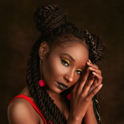 woman with braids and drop down earrings 