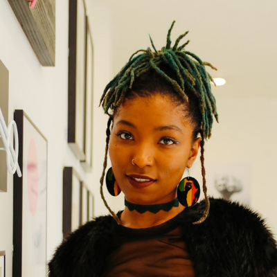 black girl wearing abstract earrings 