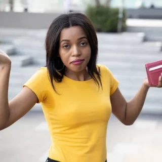 A black woman holding a wallet