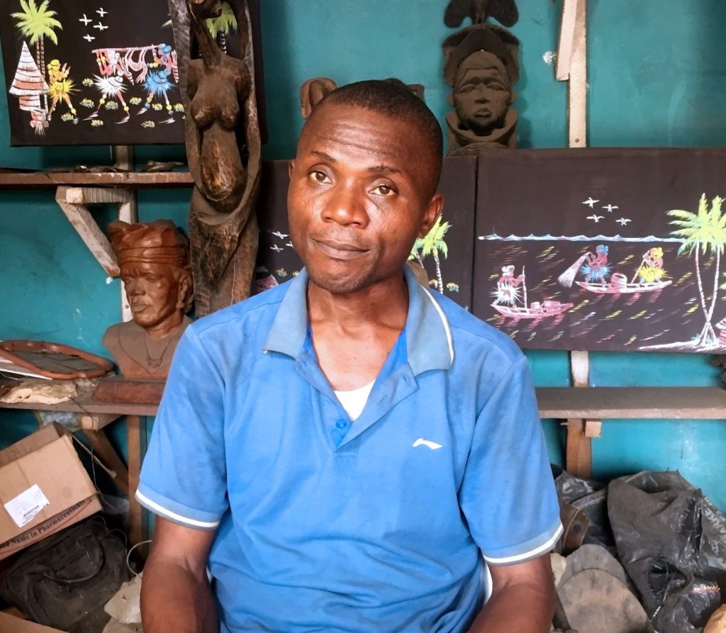 Alex Agbonmwenre, a master bronze caster in Igun street, Benin.