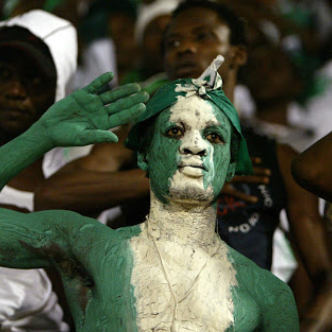 Image of man painted in Nigeria's colours