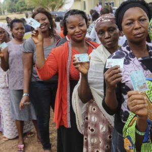 Image of women queuing to vote